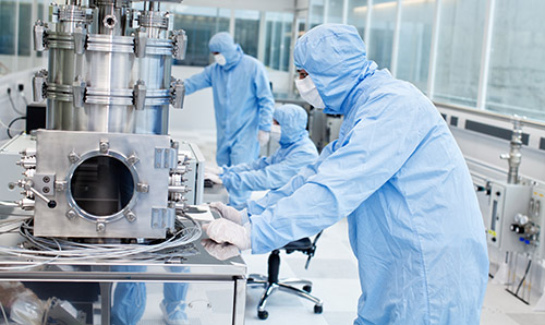 Researchers preparing graphene samples in one of the NGI's cleanrooms